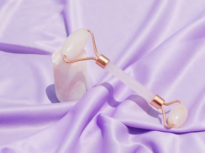Genuine Rose Quartz Facial Roller on silk