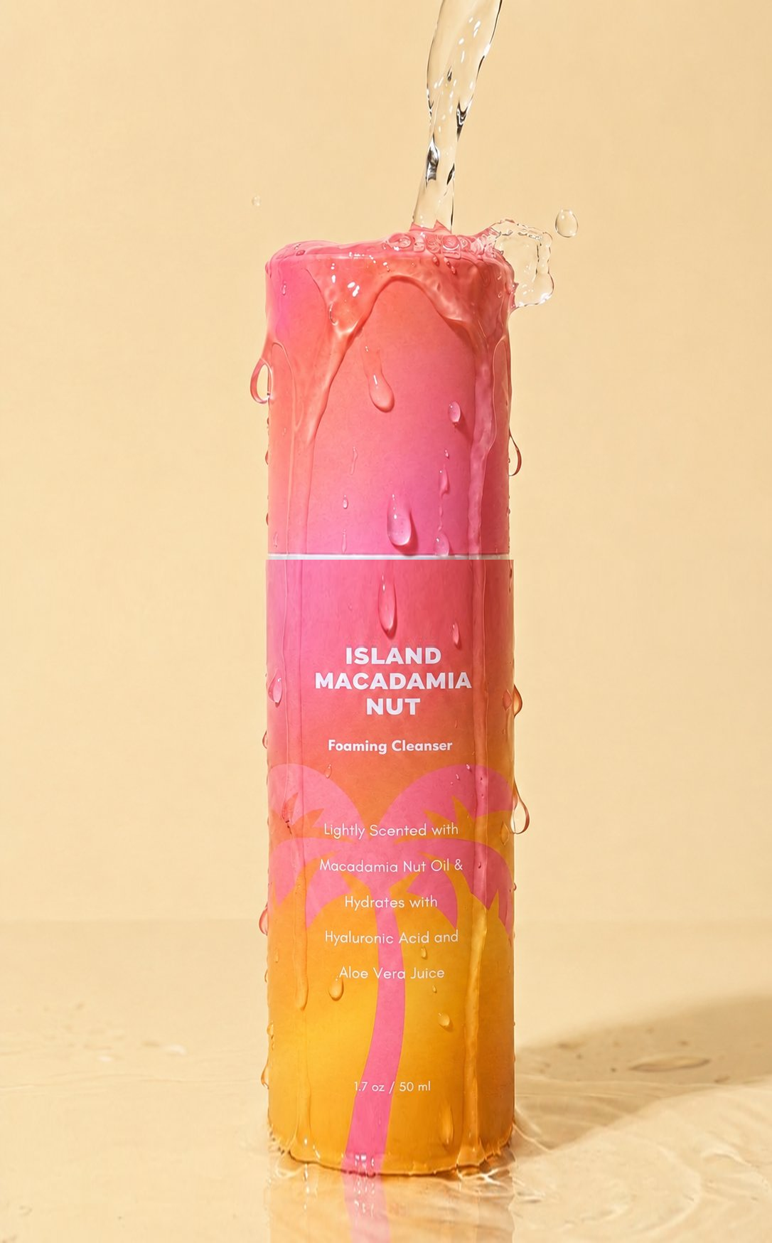 Island Macadamia Nut Foaming Cleanser with water pouring over the bottle and the white bottle seam above the product name