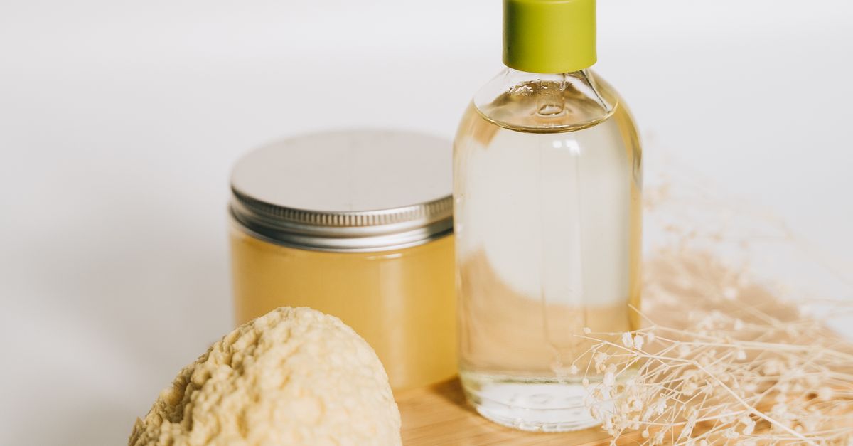 Rich botanical body butter in a bowl with a small wooden spoon