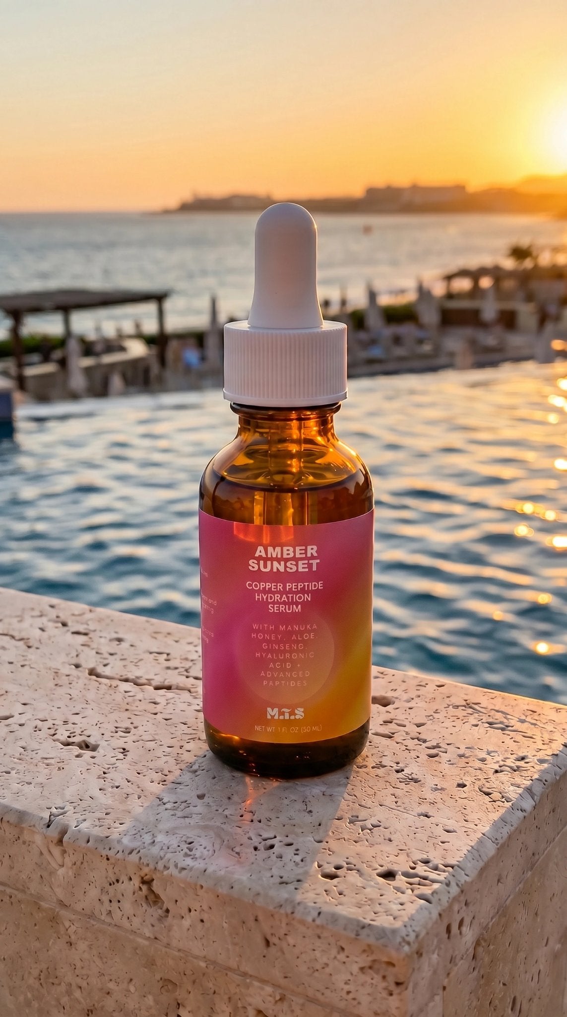 Amber Sunset serum beside a pool at sunset